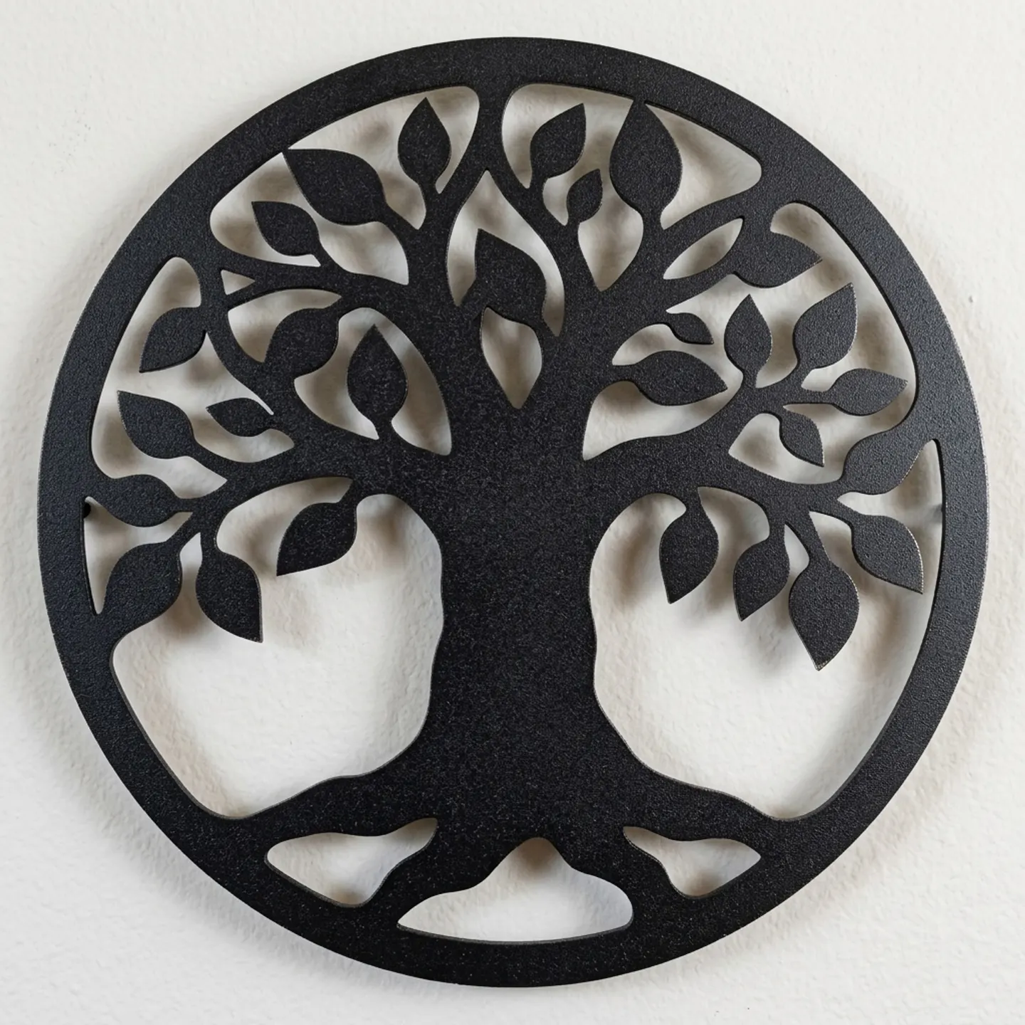 Close-up of the textured powder-coated finish on a tree of life steel wall art