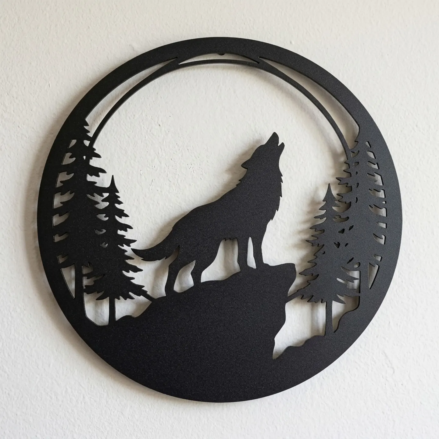 Detail of a howling wolf steel wall art showing the cut edges